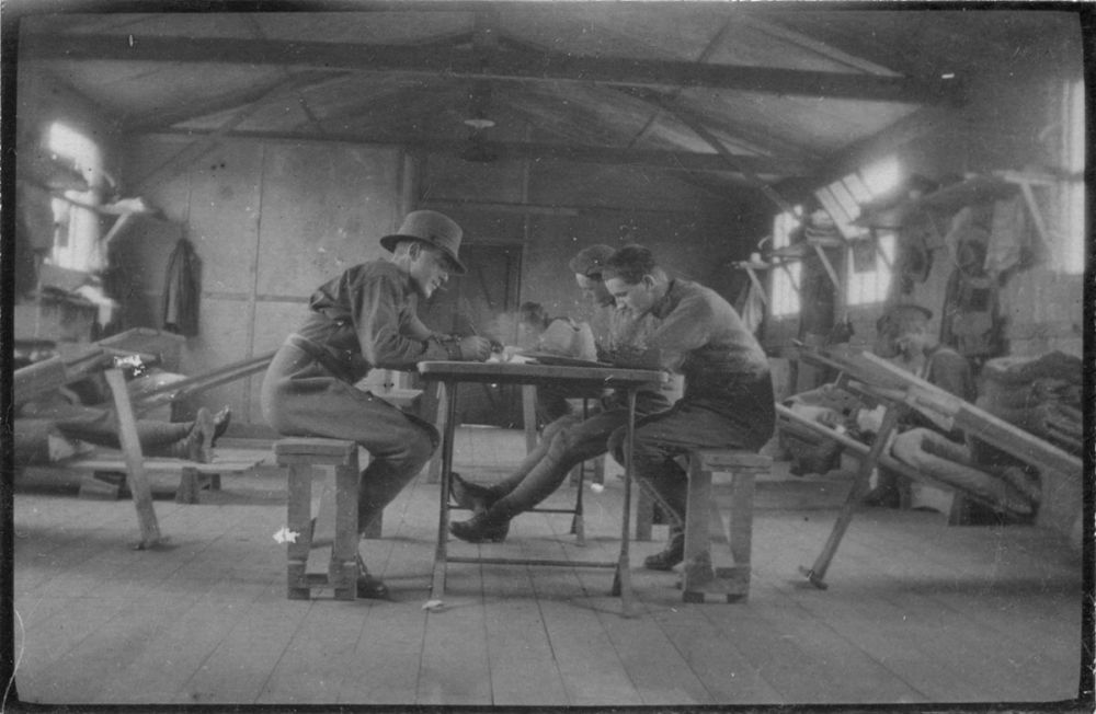 New Zealand soldiers sitting at a table, probably in their barracks, Sling Camp, Bulford, England.